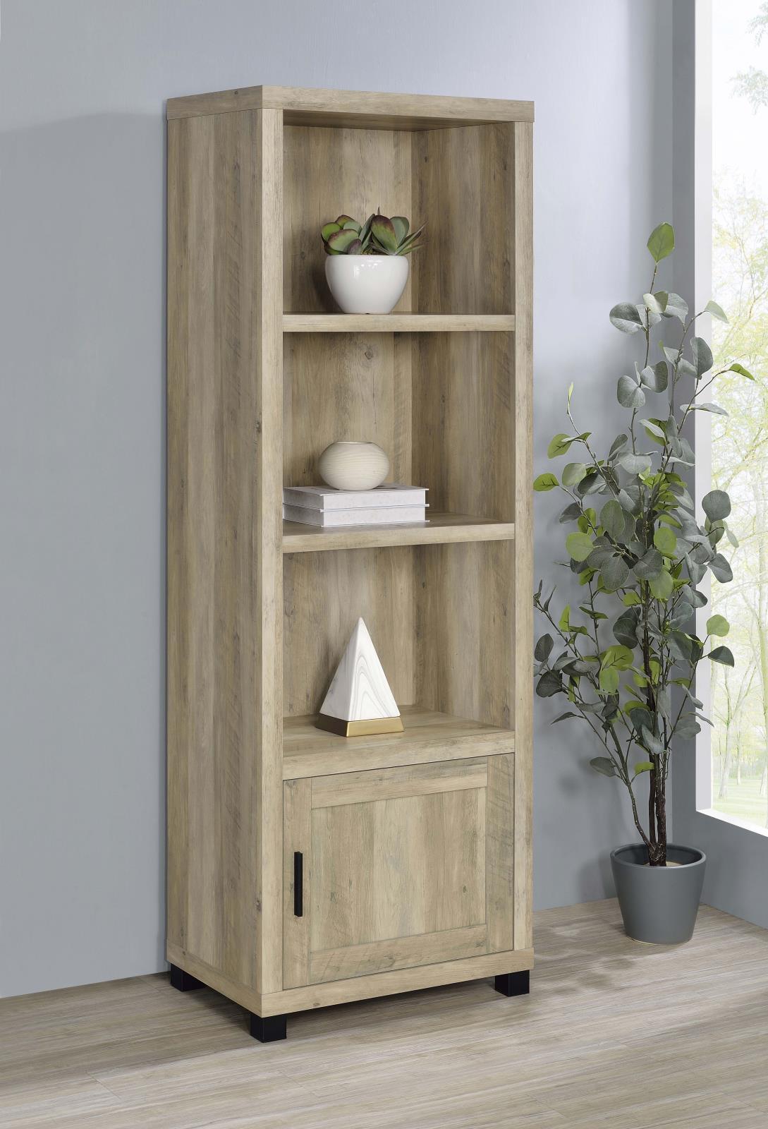 Side angle of vertical media tower showing shelves and cabinet door