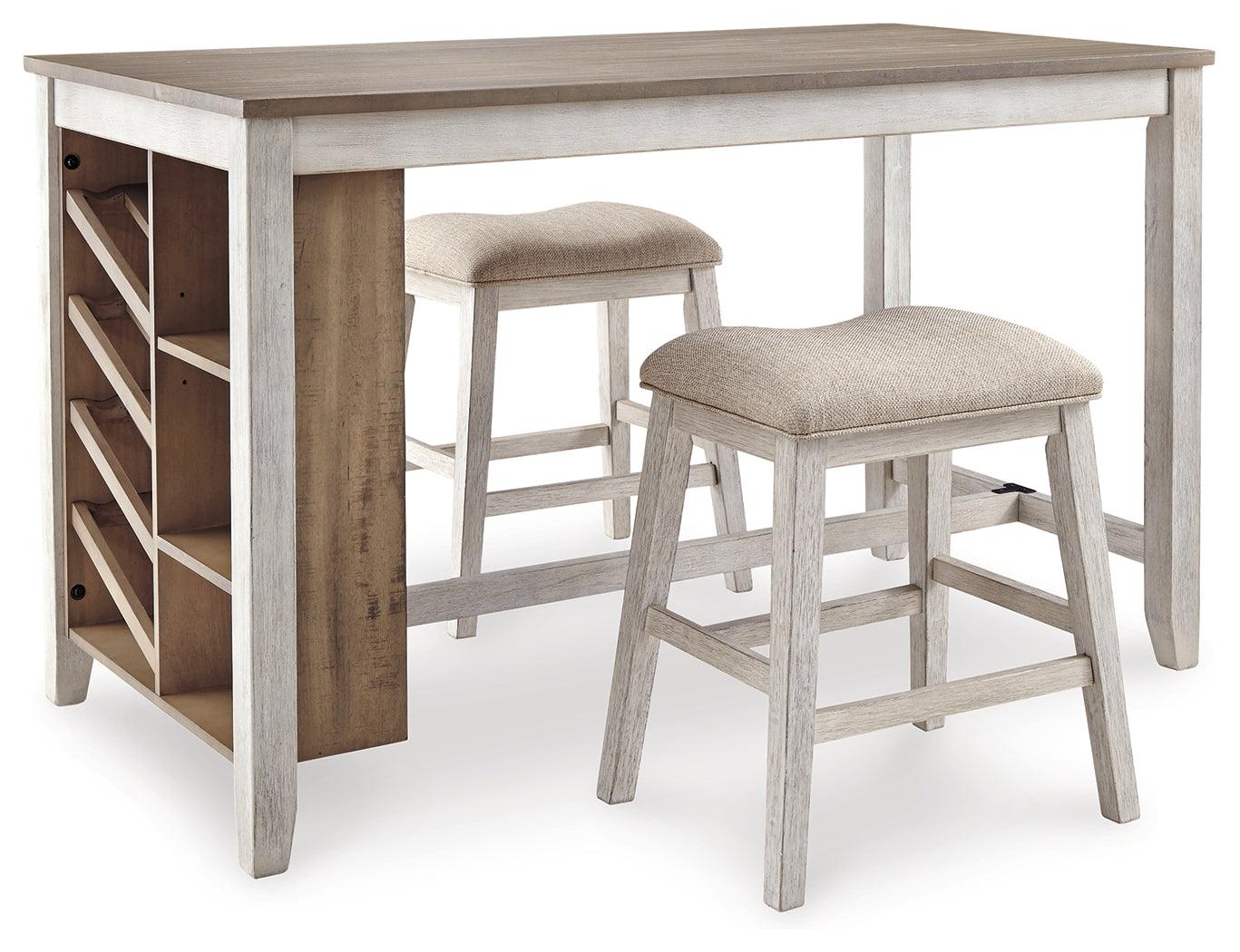Two upholstered backless bar stools with distressed grayish white finish beside Skempton dining table