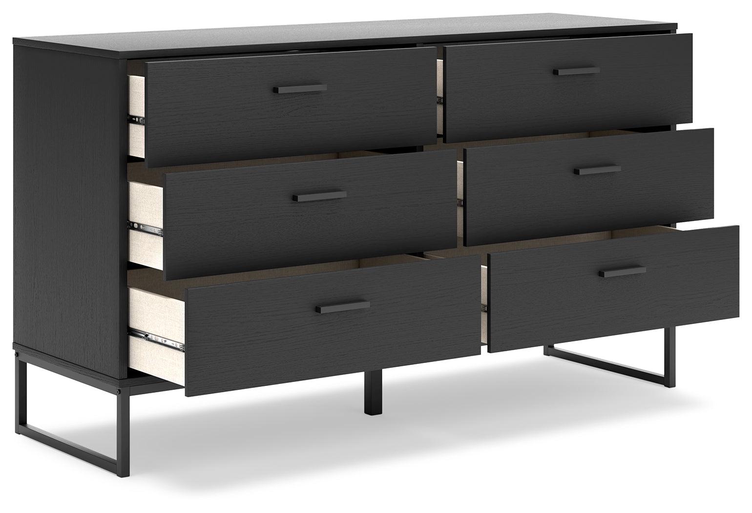 Close-up of dark pewter-tone metal drawer pulls on Socalle dresser