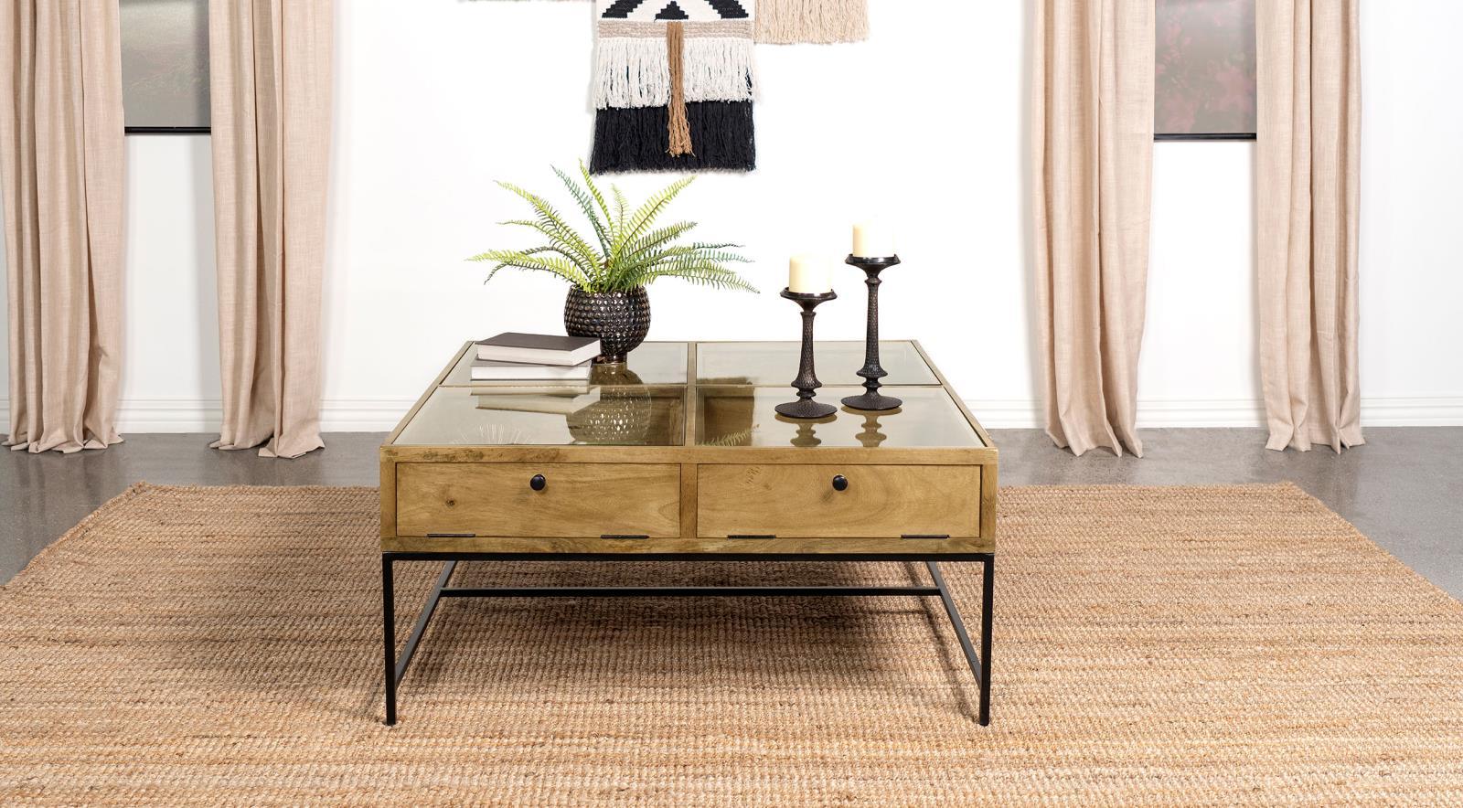 Shadowbox compartments visible under tempered glass top of Stephie coffee table