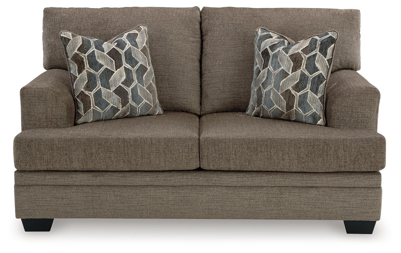 Stonemeade Loveseat with accent pillows in nutmeg