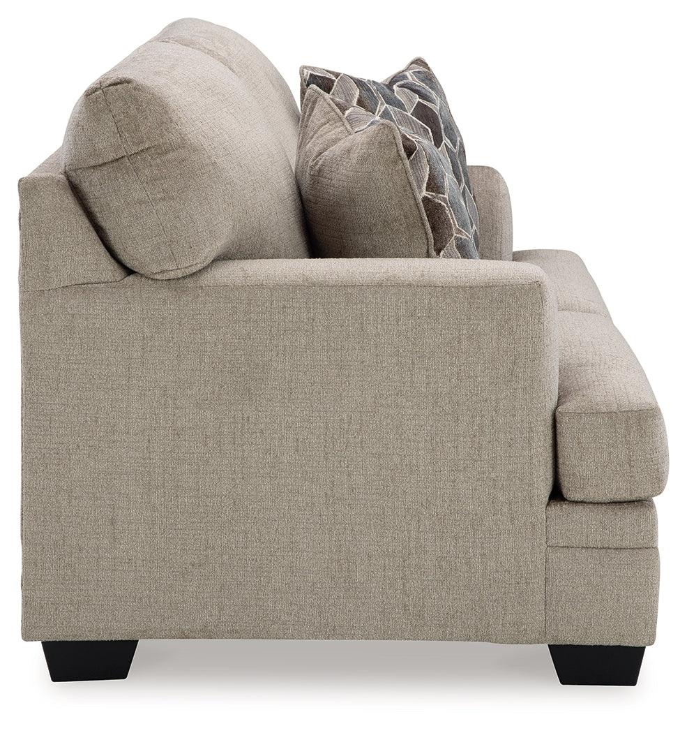 View of loveseat legs with faux wood finish