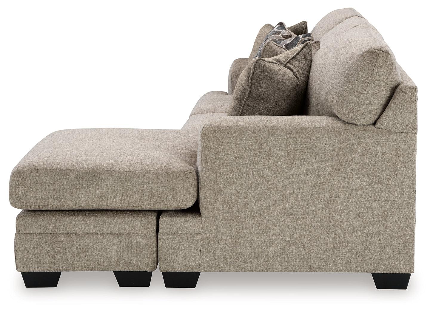 Exposed faux wood finish feet on sofa chaise