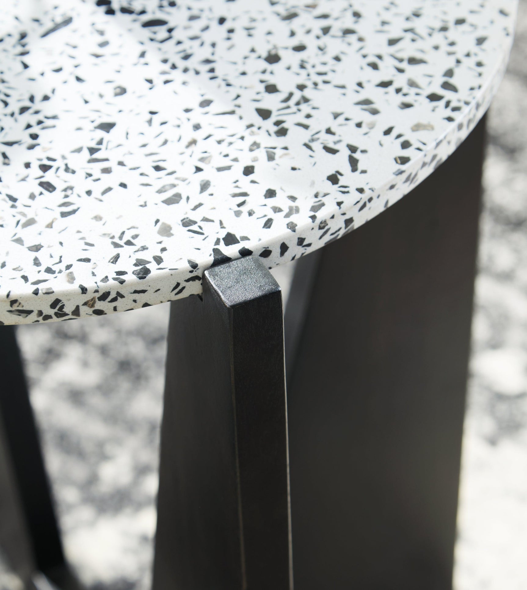 Top view of Tellrich black and white terrazzo round accent table