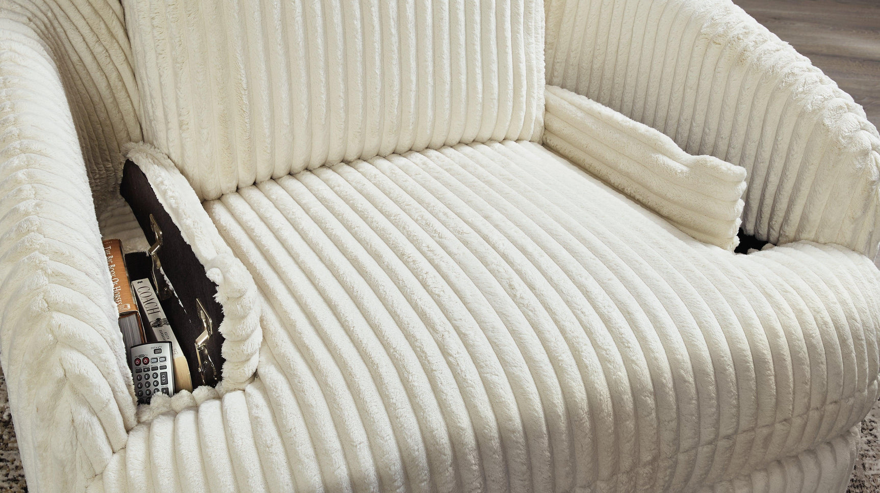 Front angle of ivory velvet glider recliner