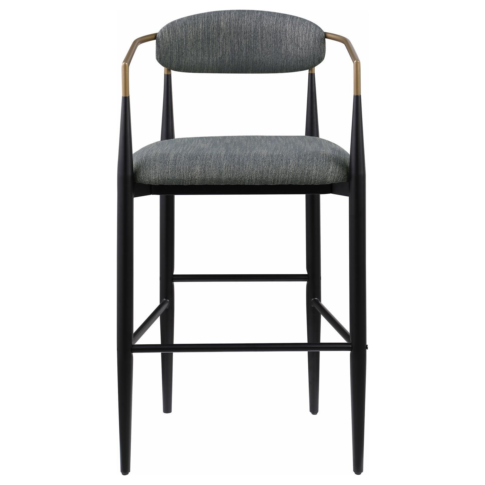 Black metal base with footrest on Tina pub height bar stool