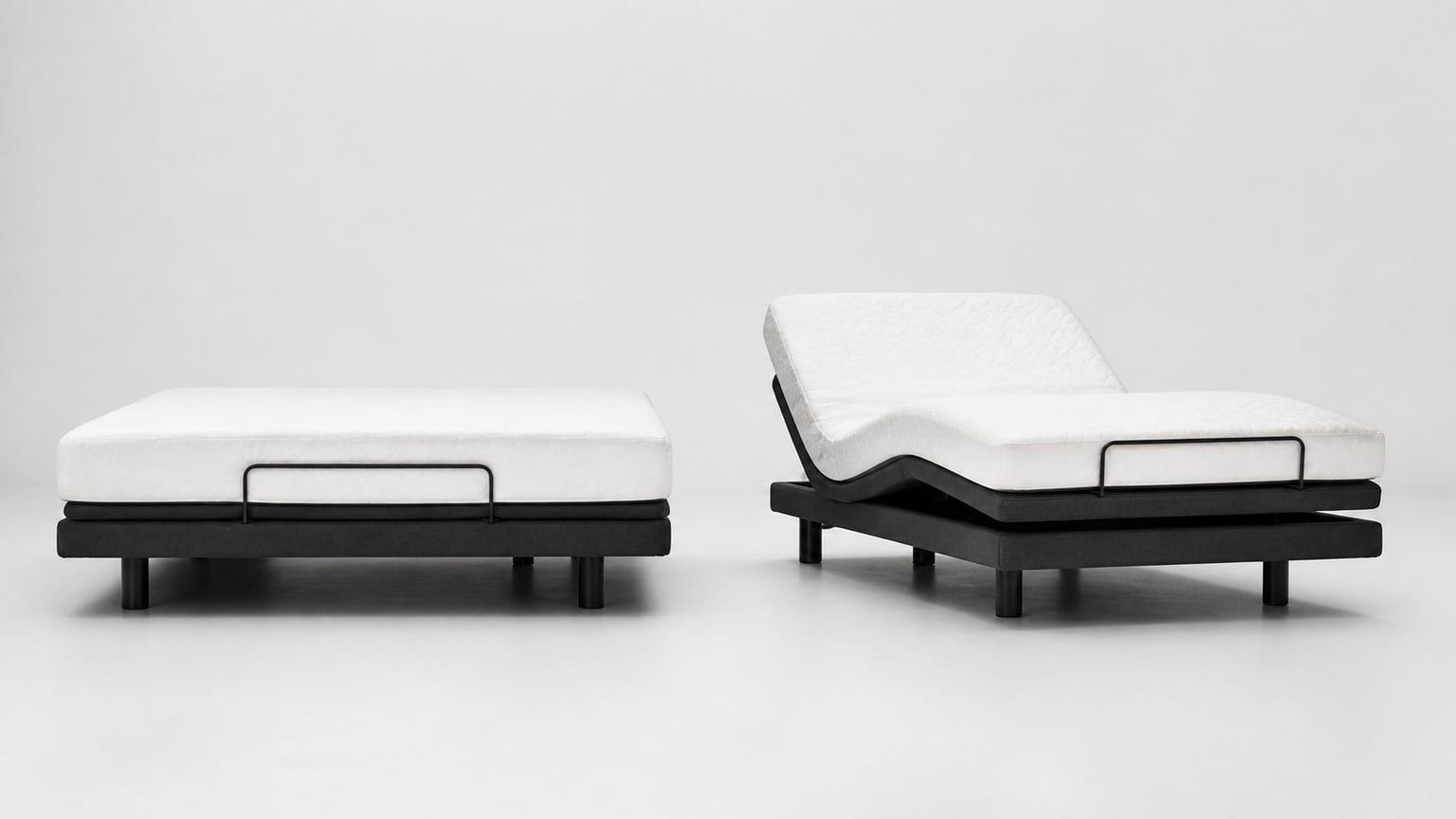 Modern adjustable bed base with mattress foundation, head elevated, on white background
