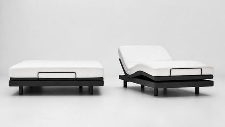 Modern adjustable bed base with mattress foundation, head elevated, on white background