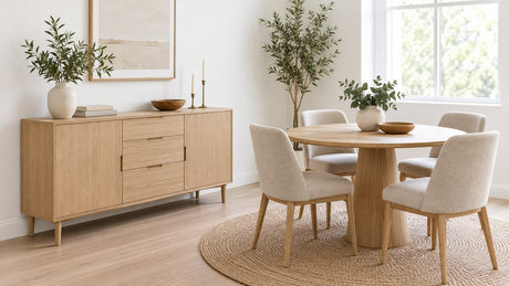 Small dining room with a modern wooden buffet featuring raised legs and decorative accessories on top