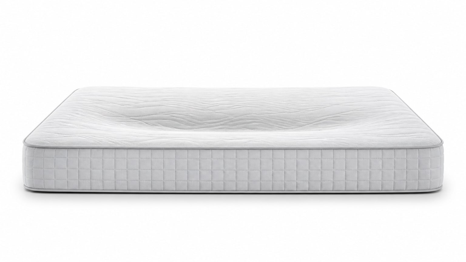 Studio photo of a mattress showing different firmness comfort layers with a clean white background