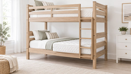 Wooden twin-over-twin bunk bed with guardrails and ladder in a bright neutral bedroom