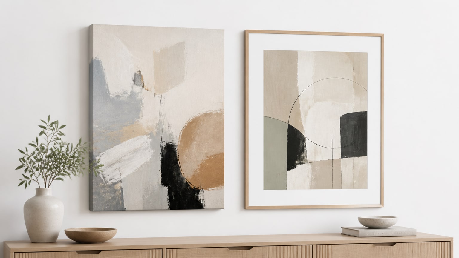 Living room wall with modern canvas art and framed art pieces, showcasing abstract and botanical themes on a clean white background