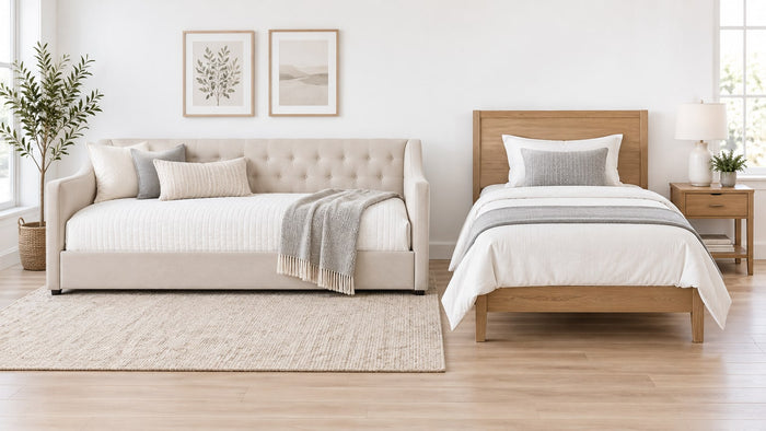 Wooden daybed in a bright white bedroom with twin mattress and neutral bedding.
