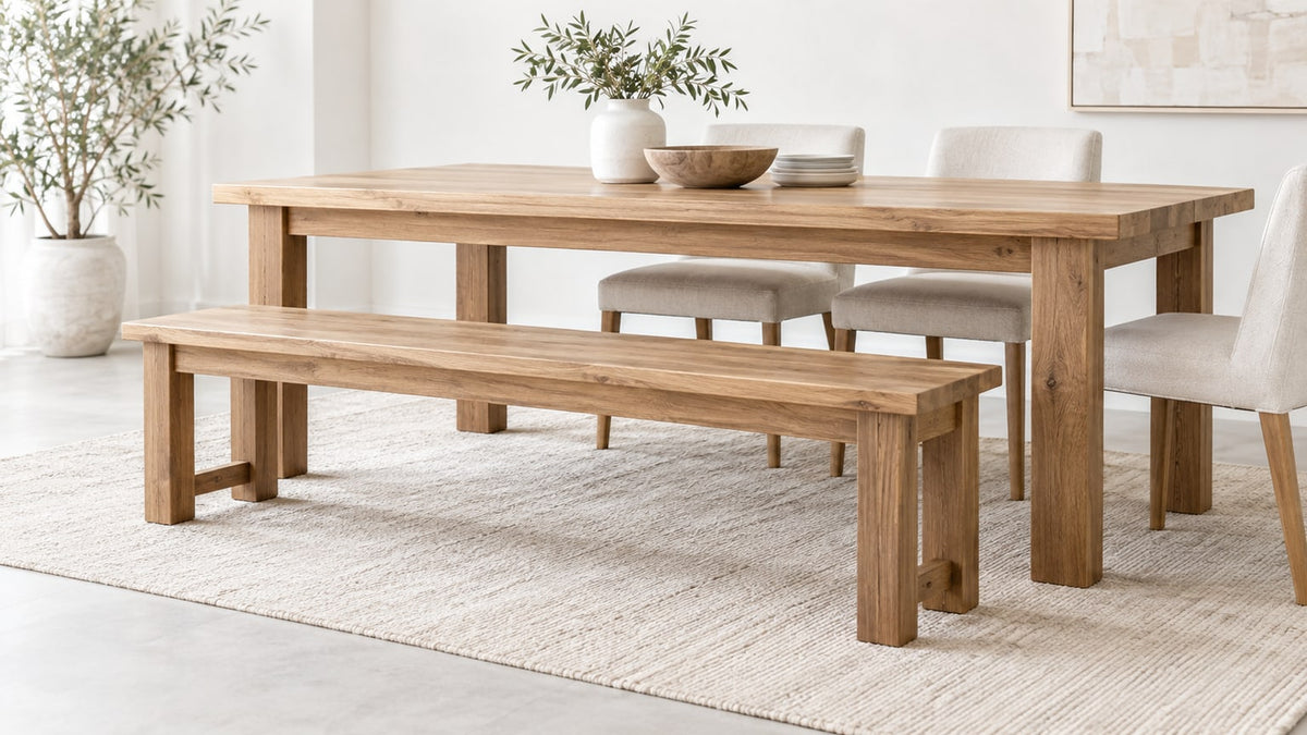 Modern wooden dining benches paired with a wooden dining table in a bright neutral dining room