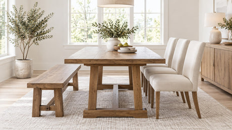Dining room featuring a wooden dining bench alongside dining chairs at a contemporary dining table on a neutral background
