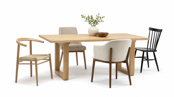 Assorted stylish dining chairs including upholstered and wooden designs on a white background