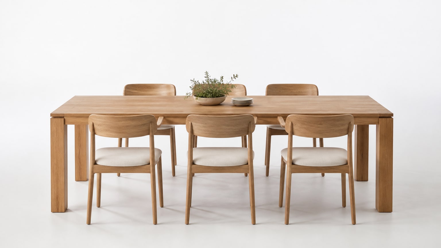 Rectangular wooden dining table with six chairs on a clean white background