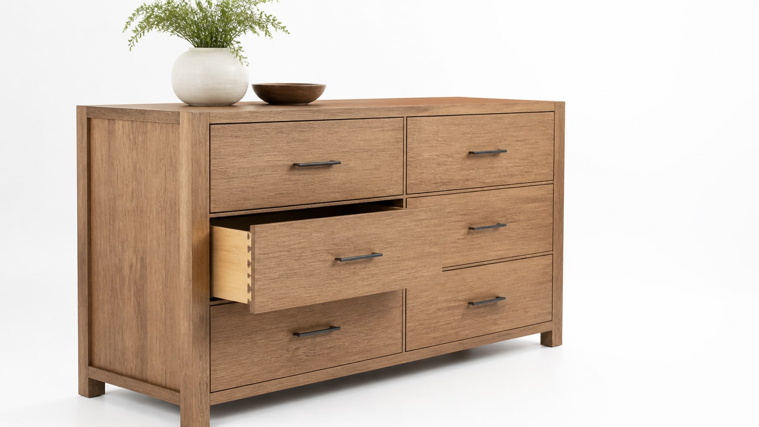 Modern wooden bedroom dresser with drawers on white studio background