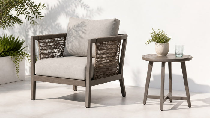 Modern outdoor sectional sofa and dining table set on a bright white patio background