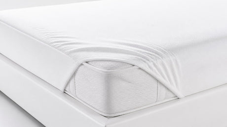 Close-up view of a modern mattress on a bed frame with white background showcasing clean fabric and smooth surface