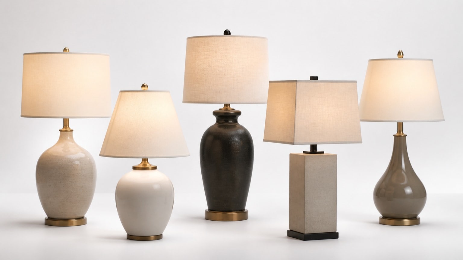 Modern table lamp with warm drum shade on white background showcasing size and style