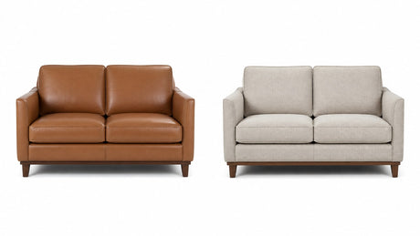 A side-by-side image of a leather loveseat and a fabric loveseat on white background displaying their upholstery and style differences clearly.