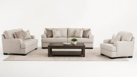 Coordinated living room furniture set including sofa, loveseat, chair, coffee table, and rug on white background