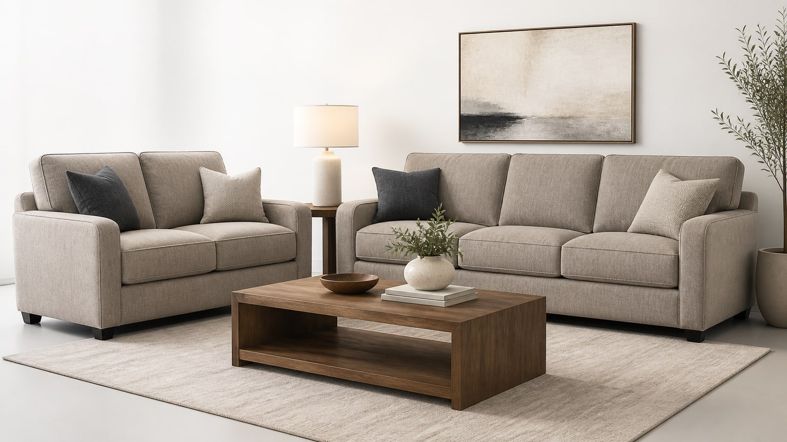 Coordinated loveseat and sofa pairing in neutral tones with matching living room furniture on white background
