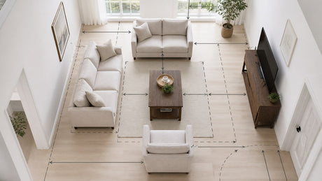 Coordinated living room furniture set with sofa, loveseat, reclining chair, coffee table, and rug on white background