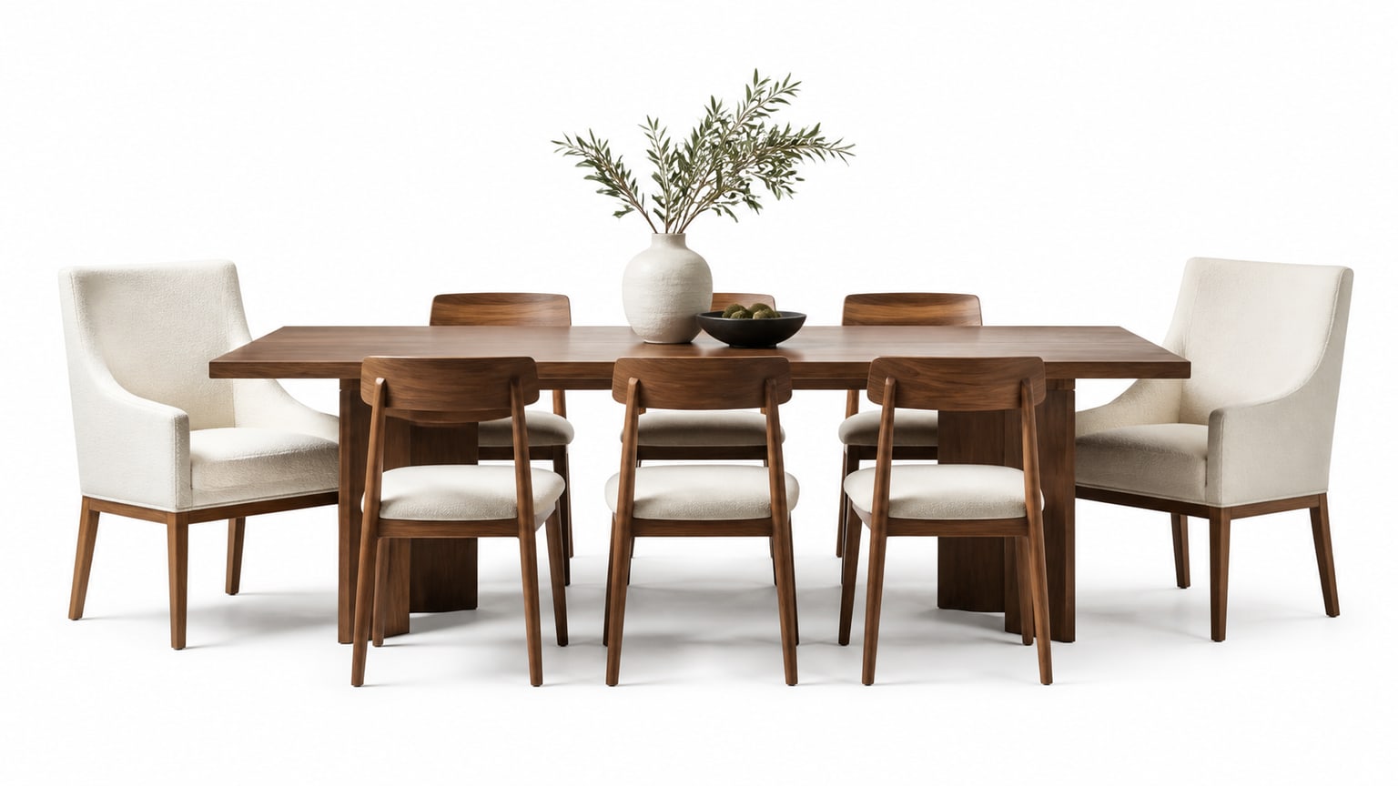 Varied dining chairs mixed in style and color around a wood dining table on white background
