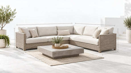 Modern L-shaped outdoor sectional with chaise and ottoman on white patio background