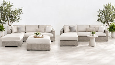 Modern outdoor sectional with ottoman on a bright white patio