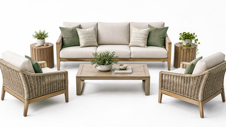 Modern outdoor sofa and chairs conversation area on a bright white patio with coffee and side tables