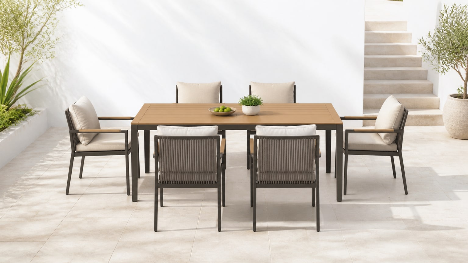 Modern patio dining set with rectangular table and cushioned chairs on bright white patio