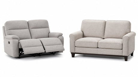 Reclining loveseat and standard stationary loveseat displayed side by side on white background for furniture comparison