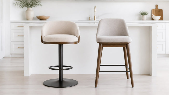 Modern swivel and stationary bar stools placed side by side in a bright white kitchen island setting on a clean white studio background.