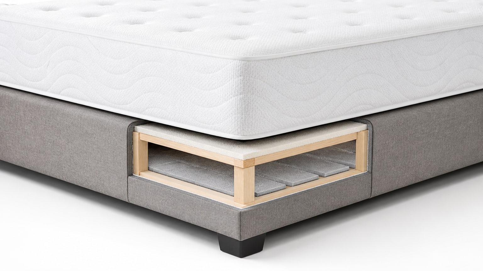 Box spring and mattress foundation on white background with wood frame