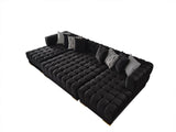Close-up of black velvet tufted upholstery on Mia Rectangle Ottoman