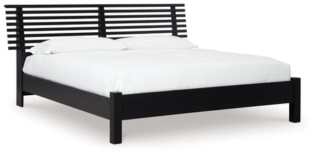 Danziar Black Queen Slat Panel Bed angled view showing headboard and slats