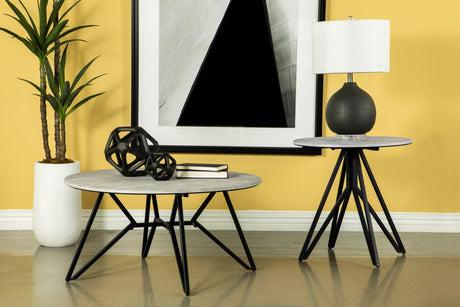 Hadi round end table with cement top and gunmetal hairpin legs front view