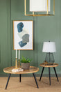 Zoe Round End Table with natural mango wood top and black iron tripod legs front view