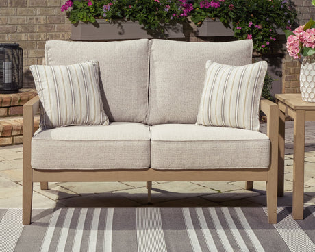 Hallow Creek Driftwood Outdoor Loveseat front angle showing cushions
