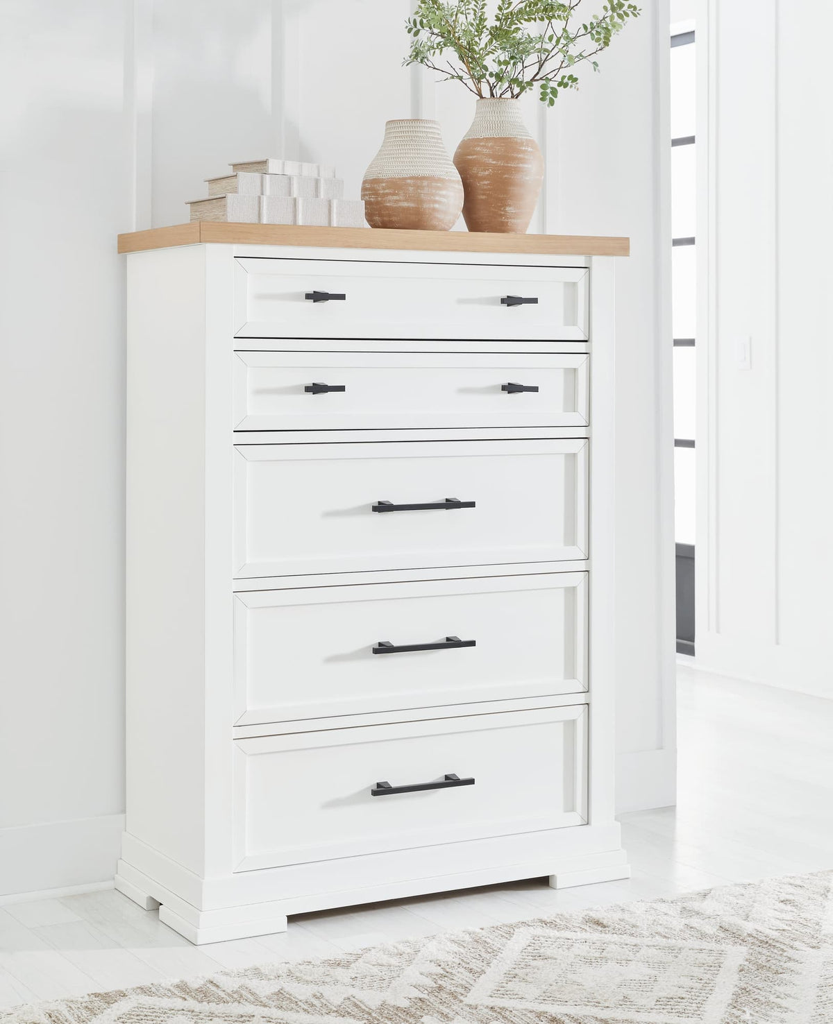 Ashbryn Chest of Drawers in white finish with natural oak top, front angle