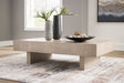 Jorlaina coffee table front angle showing textured light grayish brown finish