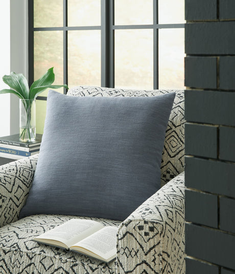 Thaneville Blue Pillow showing front woven solid design