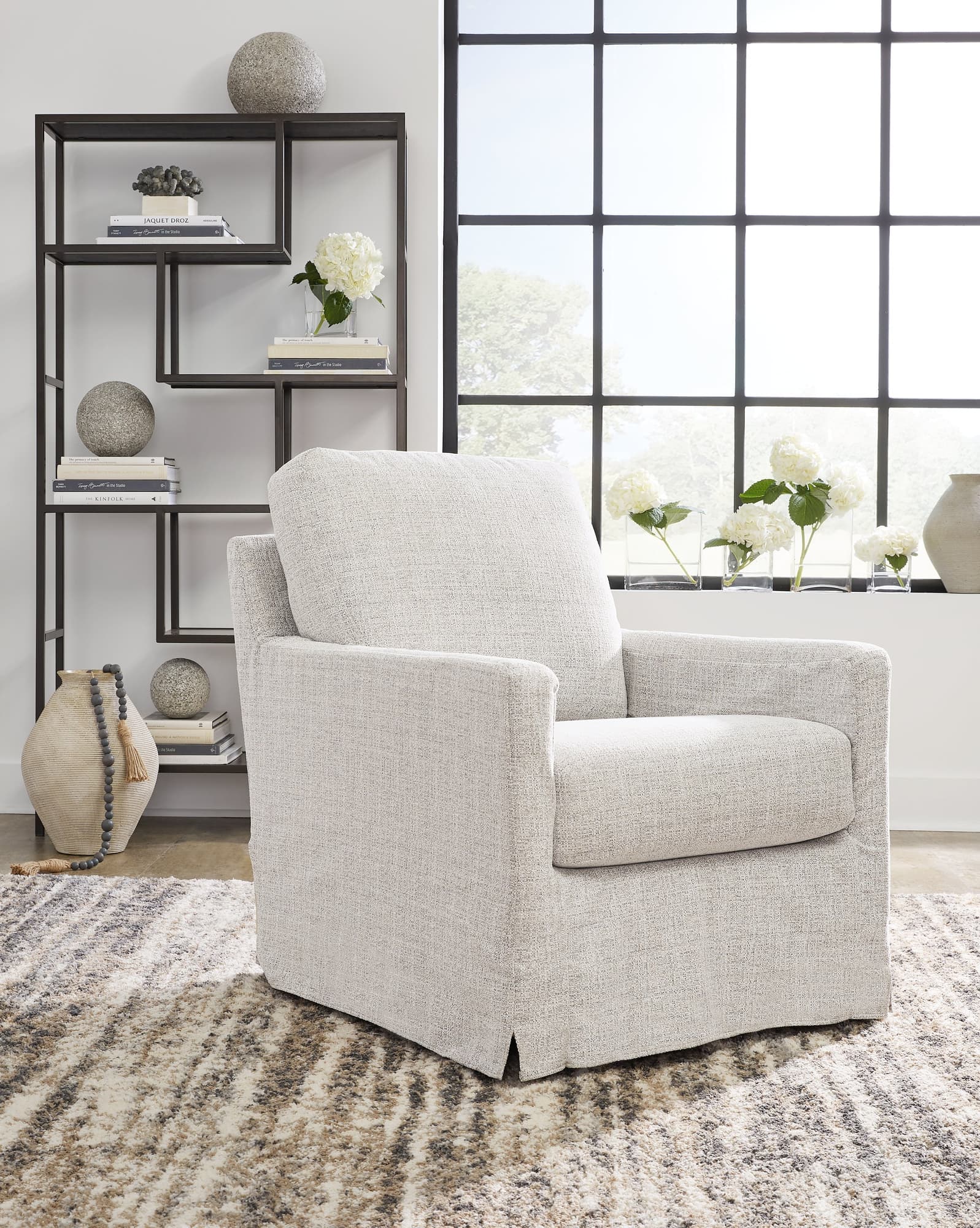 Nenana Next-Gen Nuvella Stone Swivel Glider Accent Chair front angle view