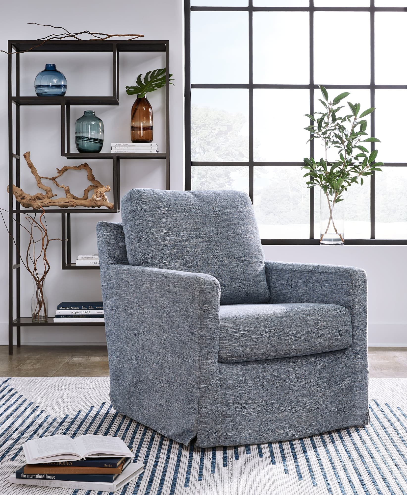 Nenana Denim Swivel Glider Accent Chair angled front view