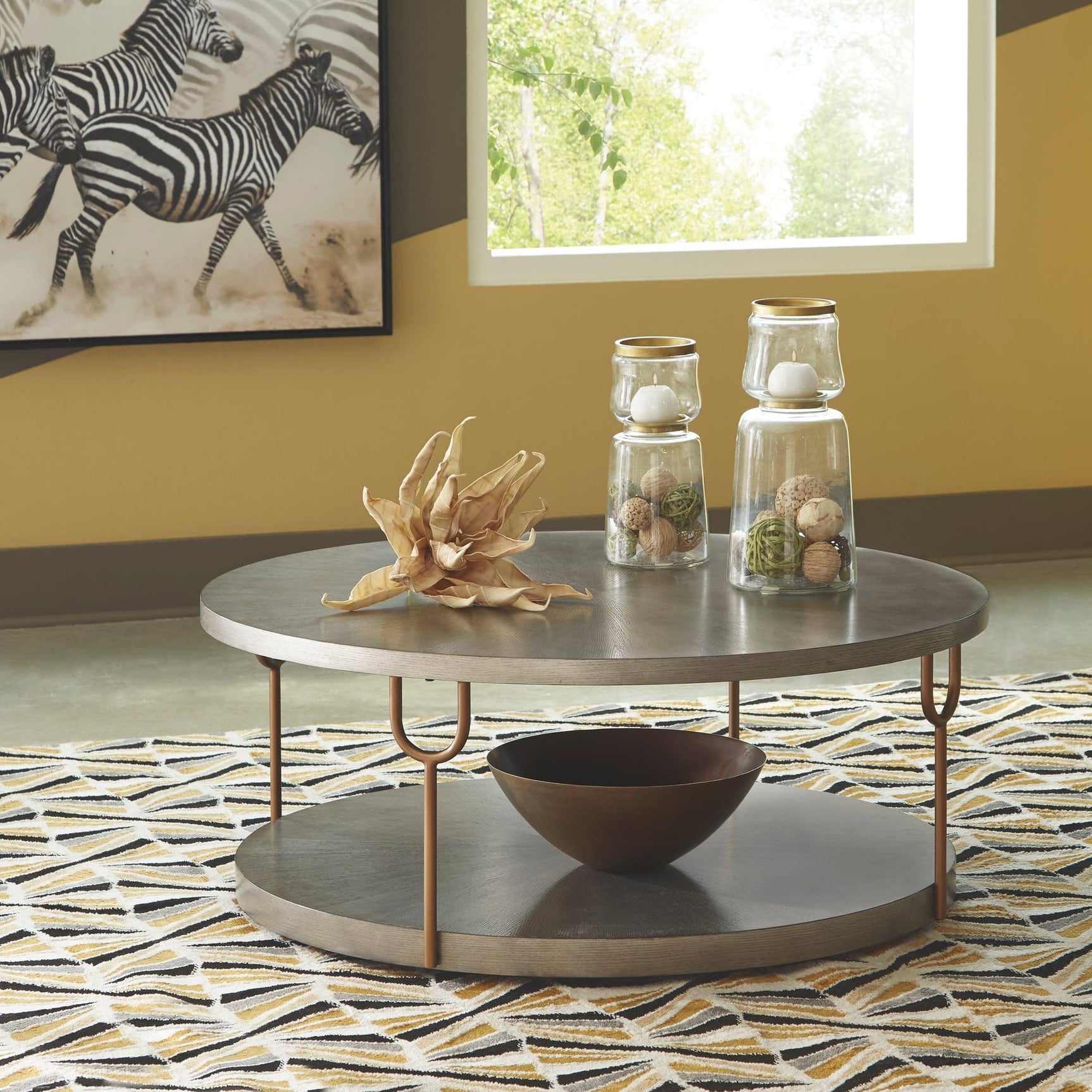 Ranoka Platinum round cocktail table with ash veneer silvertone finish viewed from top angle