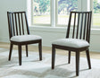 Galliden black dining chair with curved backrest and cushioned woven seat