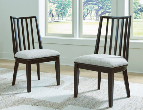 Galliden black dining chair with curved backrest and cushioned woven seat